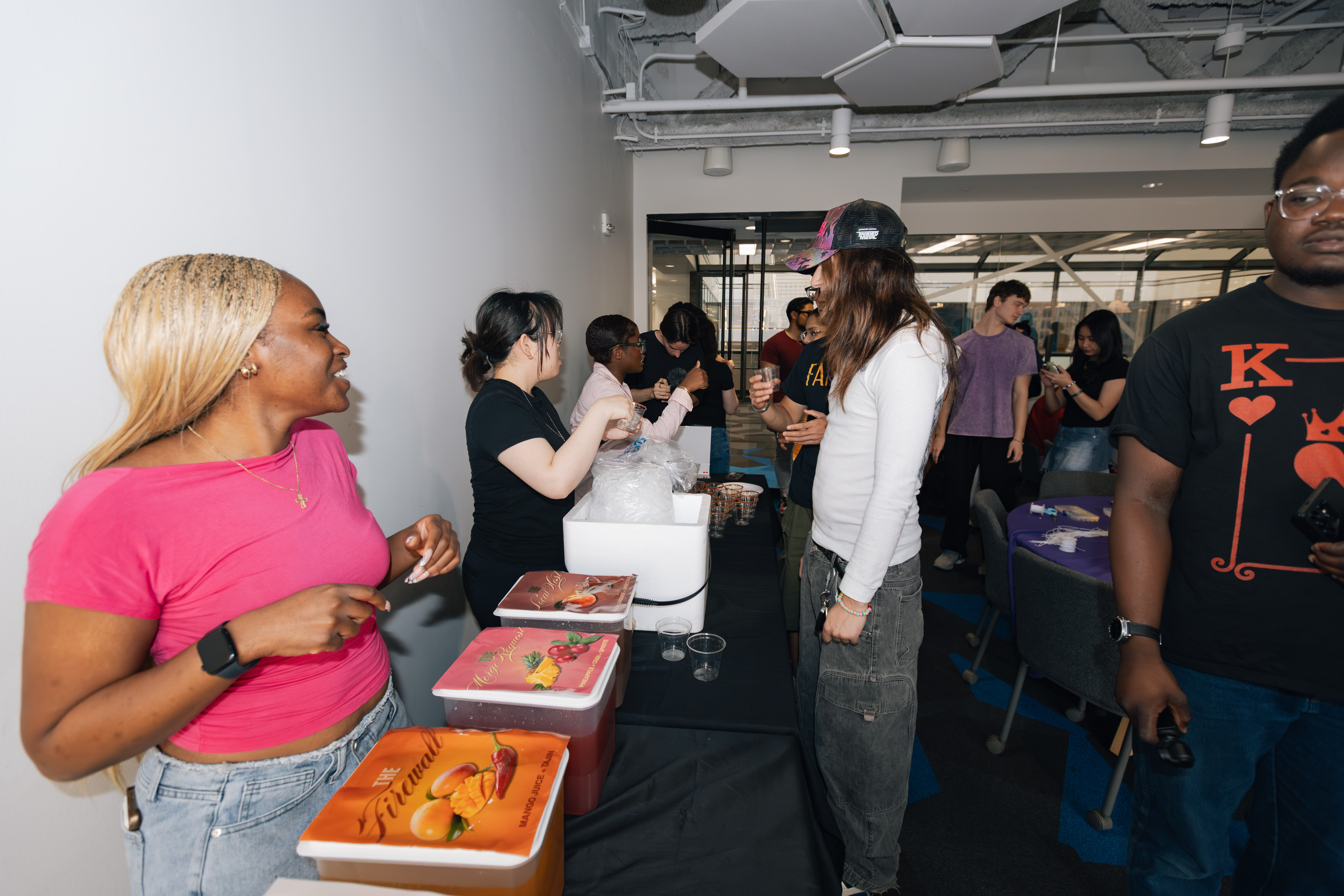 progirls members mingling and getting drinks at a mixer