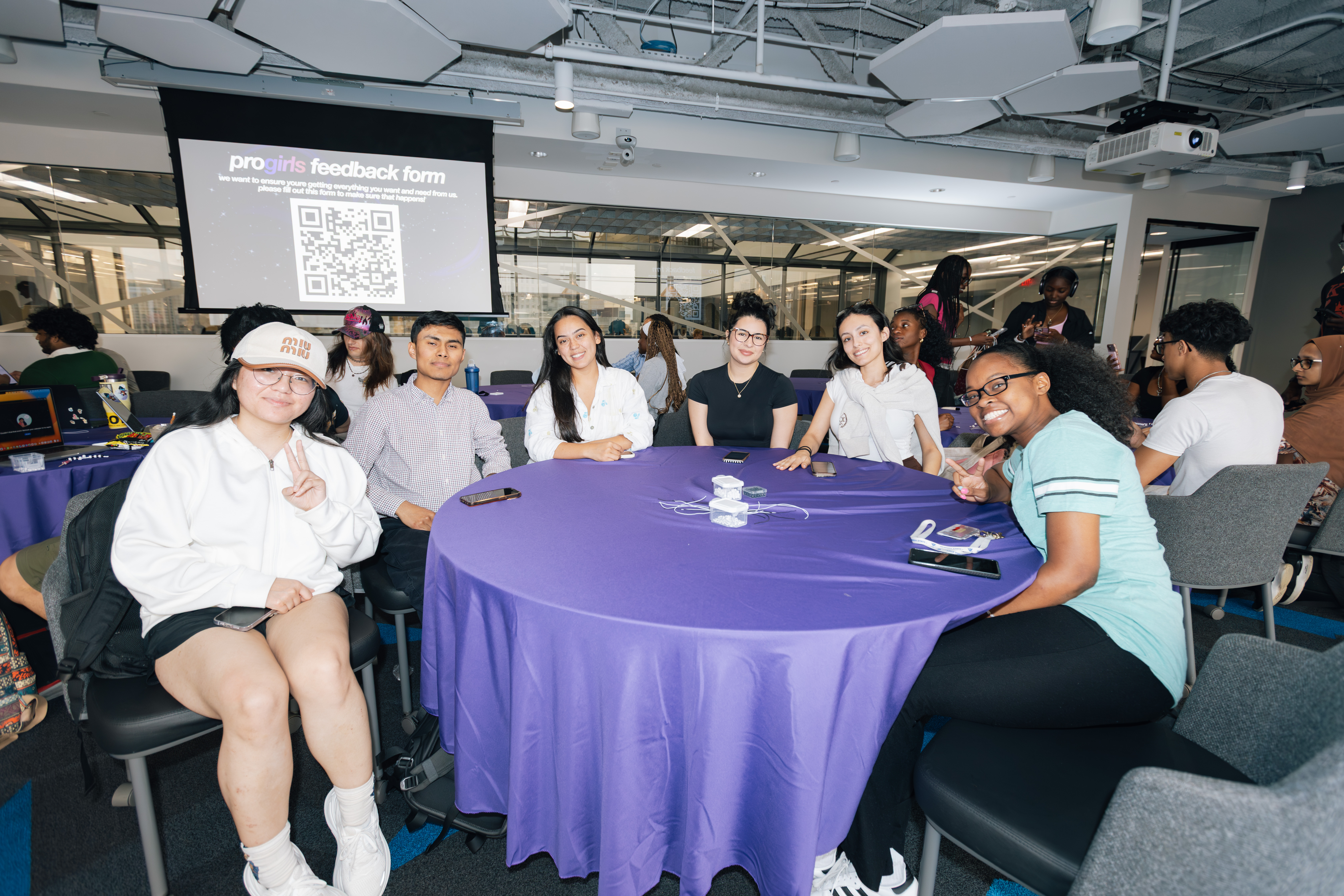 a group of progirls members smiling together at an event
