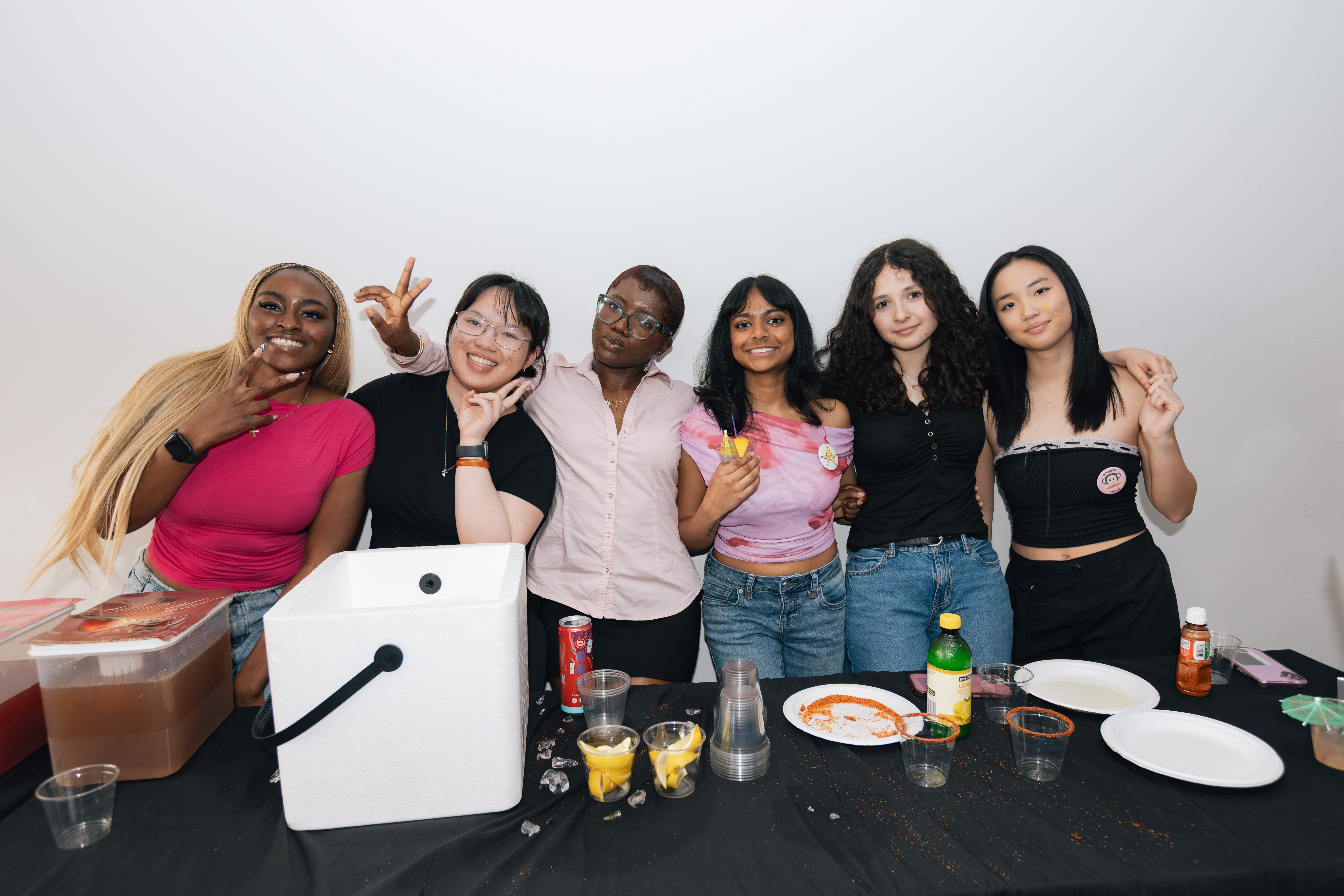 a group of progirls members posing together indoors